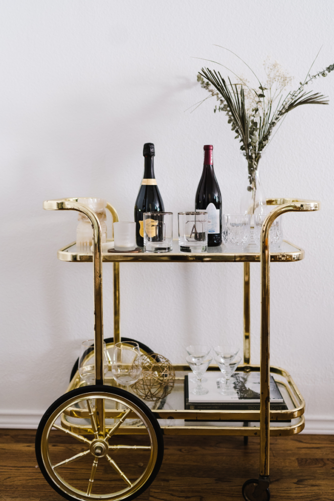 Gold bar cart with champagne bottles