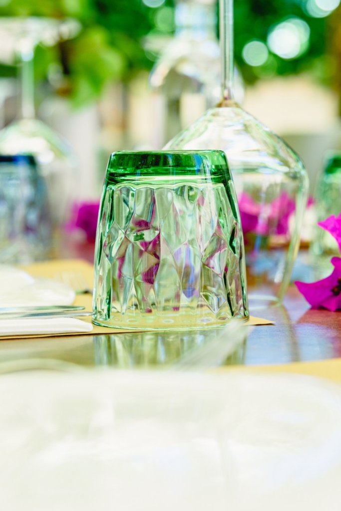 green glass table setting at your table